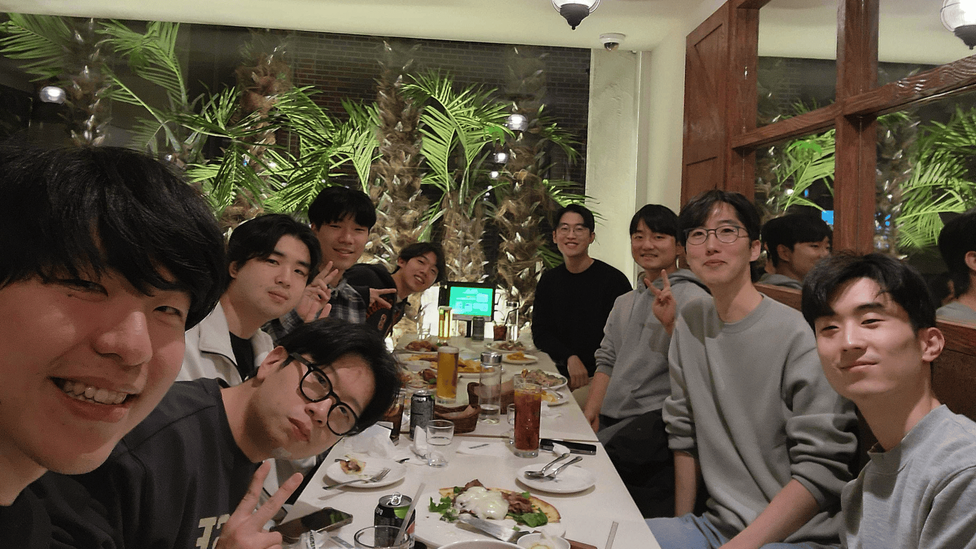 Members of the Scalable Robot Learning Lab at a lab dinner